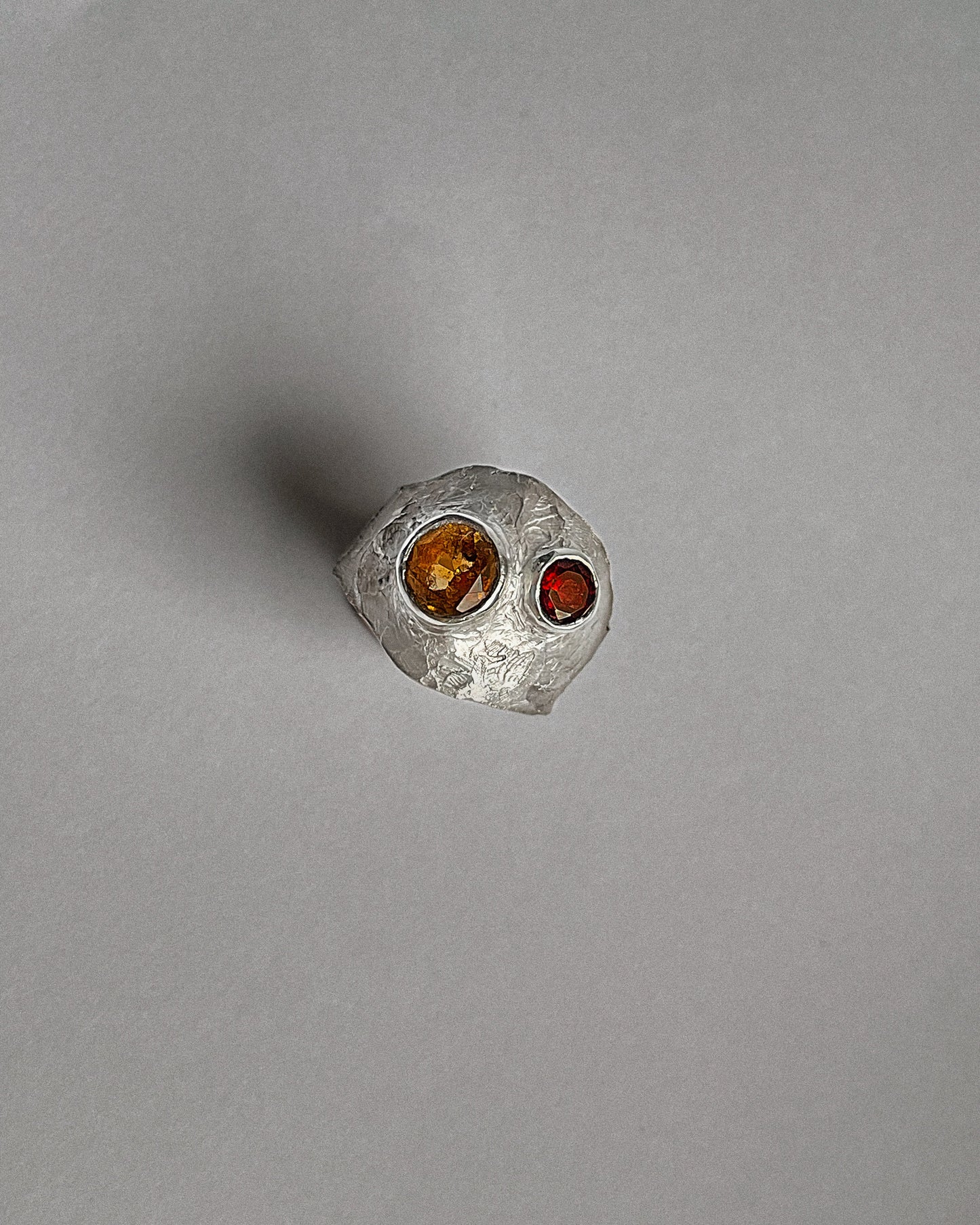 Silver ring with a red garnet and yellow sapphire