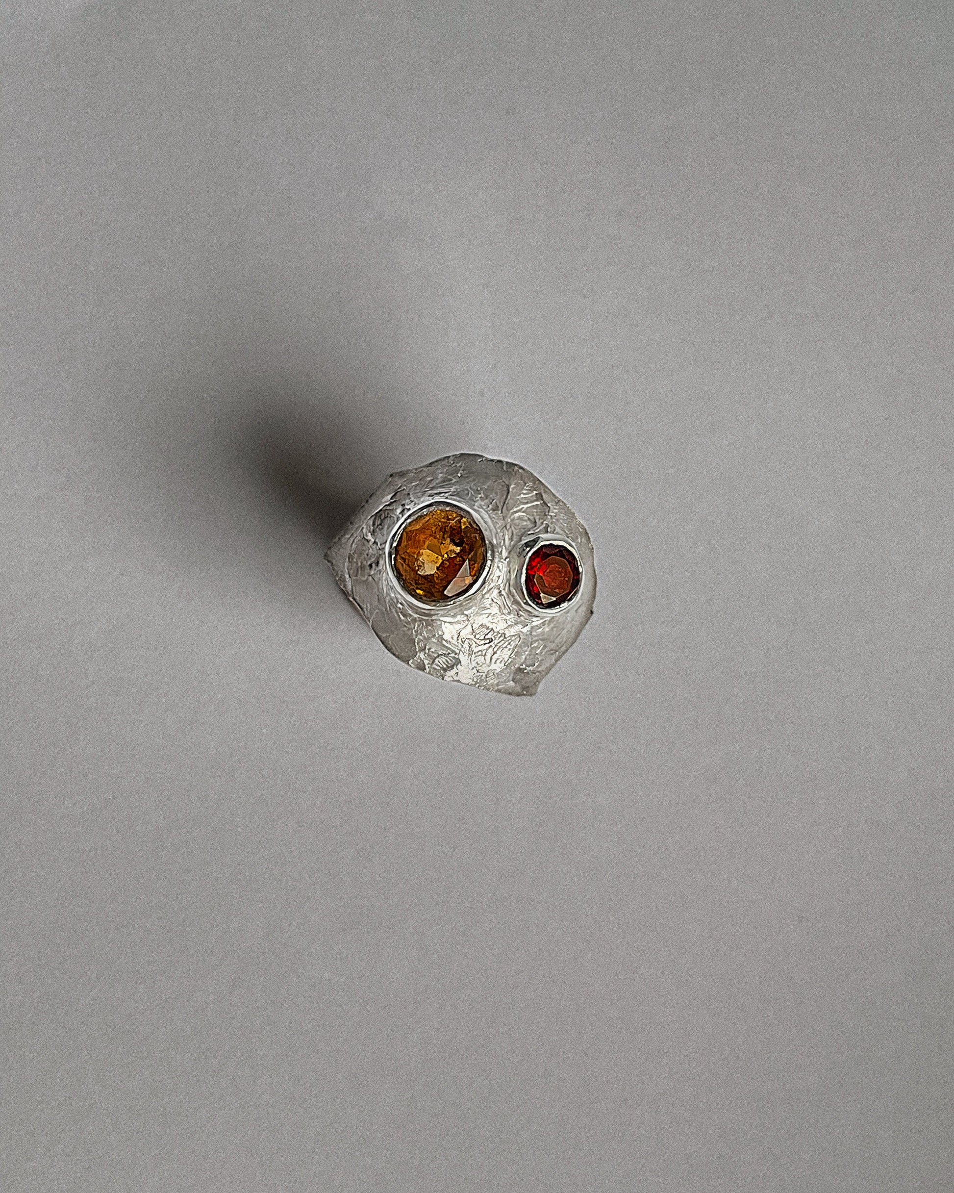 Silver ring with a red garnet and yellow sapphire