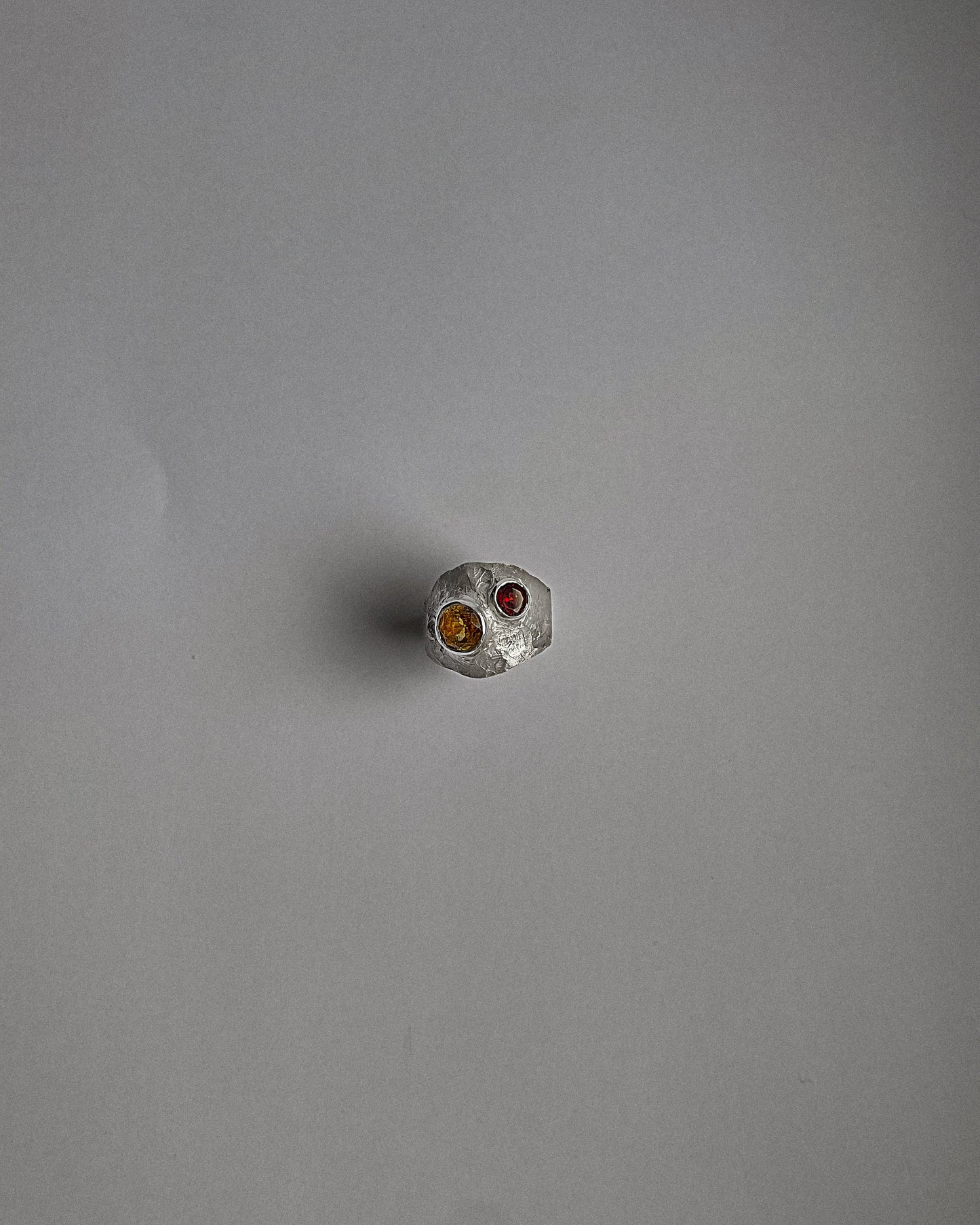 UMA silver ring with a red garnet and yellow sapphire