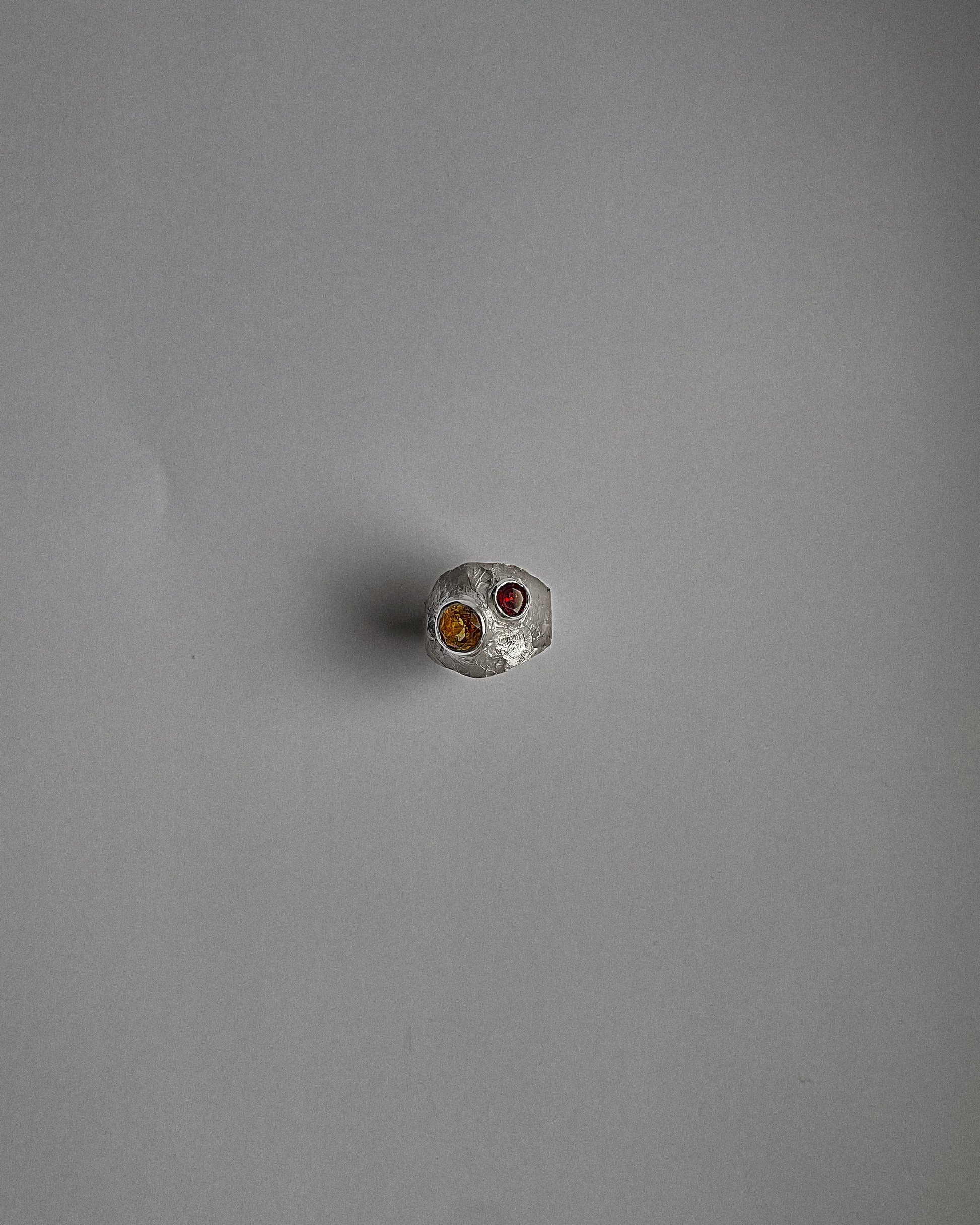 UMA silver ring with a red garnet and yellow sapphire