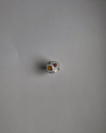 UMA silver ring with a red garnet and yellow sapphire